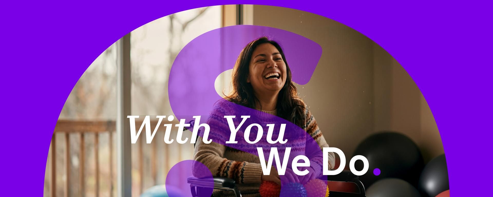 Sanofi “With You We Do” platform image featuring a smiling woman seated in a wheelchair, with the Sanofi logo and “With You We Do” message on a purple background.