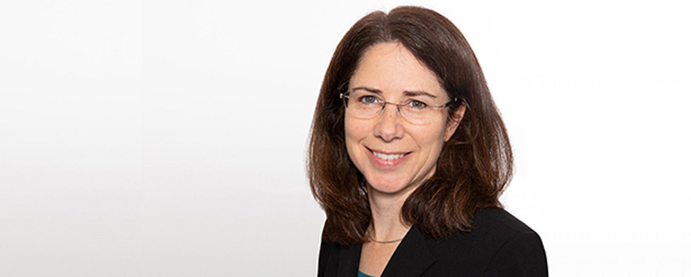 Rebecca Sendak smiles at the camera in a professional headshot.