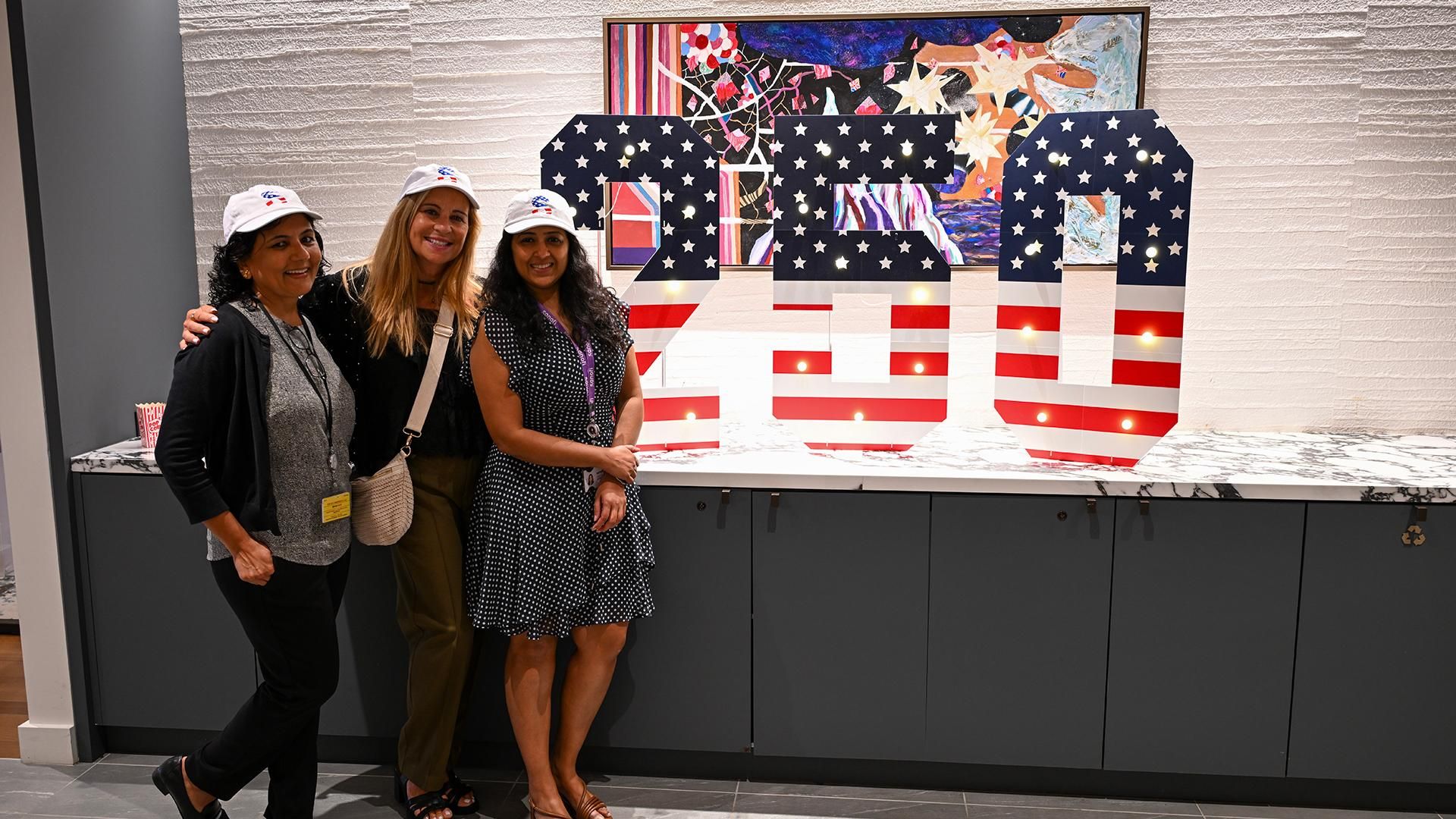 Sanofi employees pose for a group photo while participating in the company’s employee engagement experience – honoring the past, present, and future of both America and Sanofi.