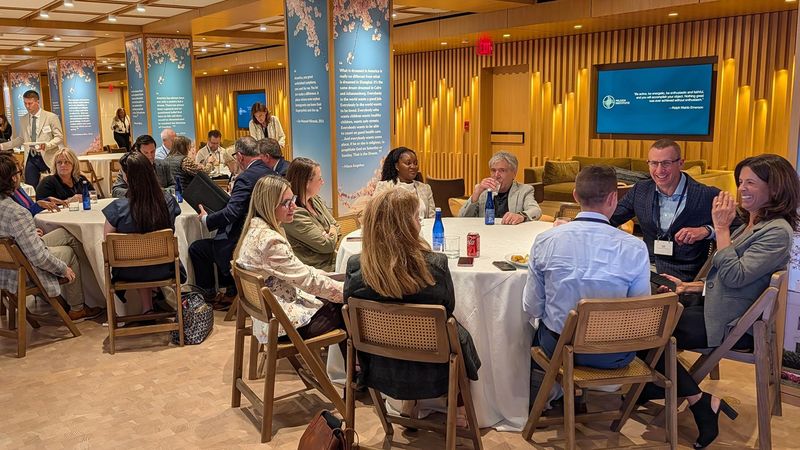 Sanofi and patient advocacy group leaders seated at roundtables during Milken Institute Patient Advocacy Forum in Washington, D.C.