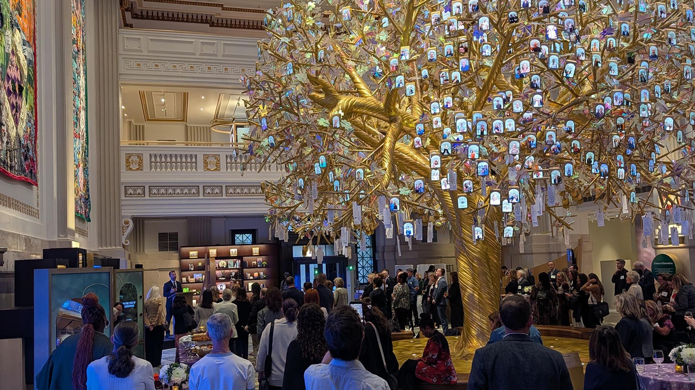 Patient advocacy leaders and Sanofi team members gather beneath the Tree of Generations sculpture at the Milken Institute Patient Advocacy Forum in Washington, D.C.