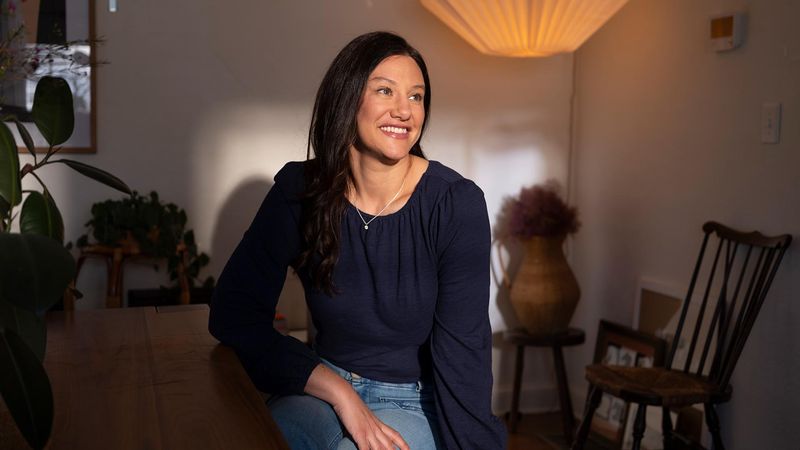 Type 1 diabetes caregiver Jenny seated in a quiet moment of reflection amid the everyday realities of supporting someone living with the disease